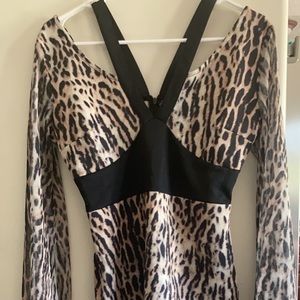 Venus size 6 animal print cocktail dress. Never been worn. Sheer bell sleeves